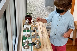 Music-cover Paula Lillard Preschlack - boy doing curiosity activity.